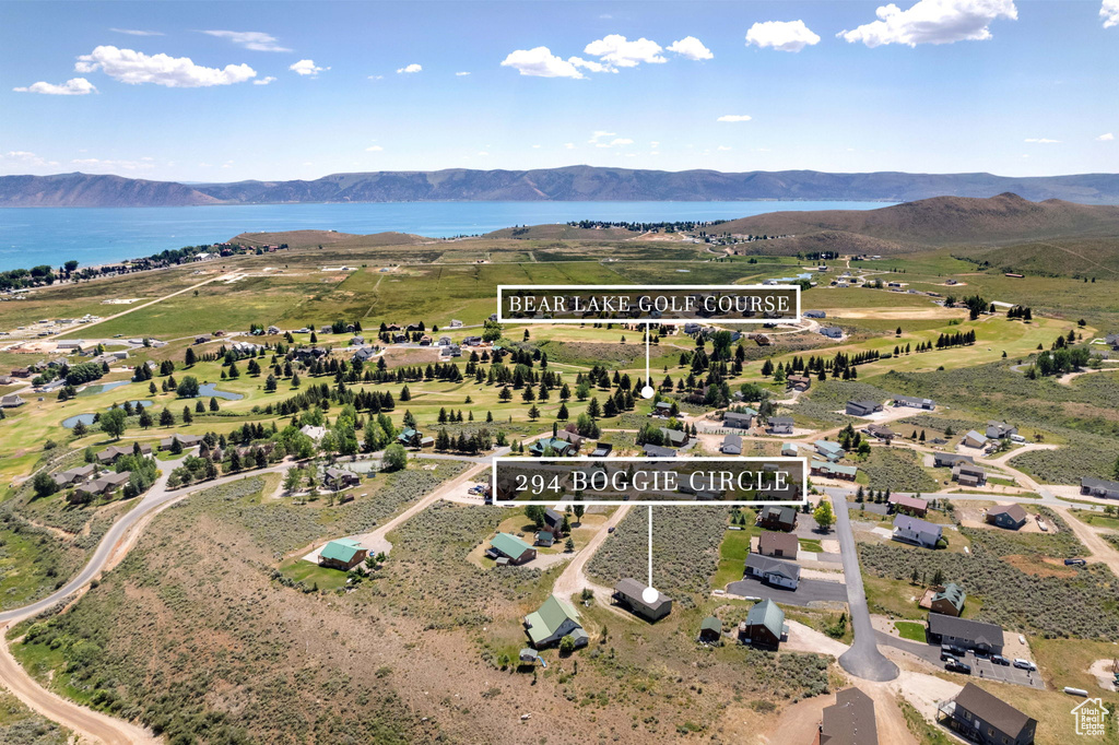 Aerial view of property's location featuring a water and mountain view