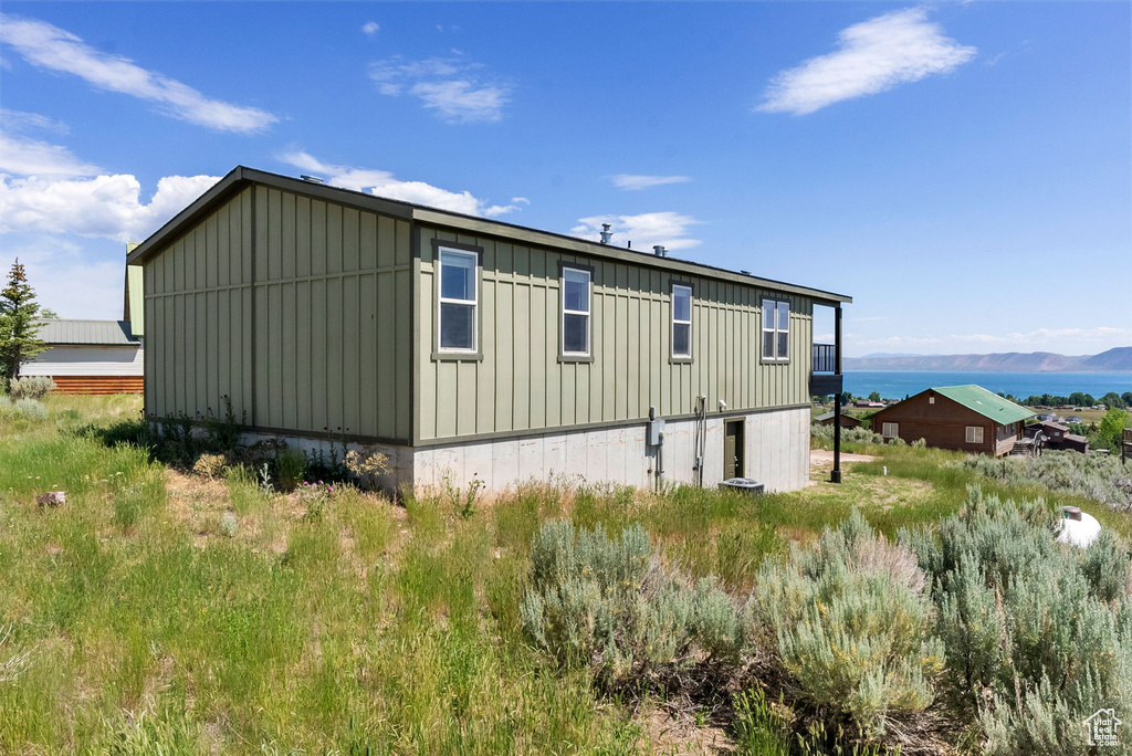 View of side of property featuring board and batten siding and a mountain view
