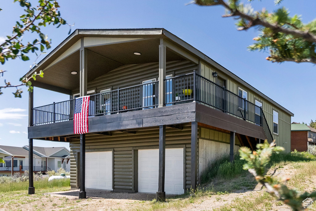 View of property exterior with a garage