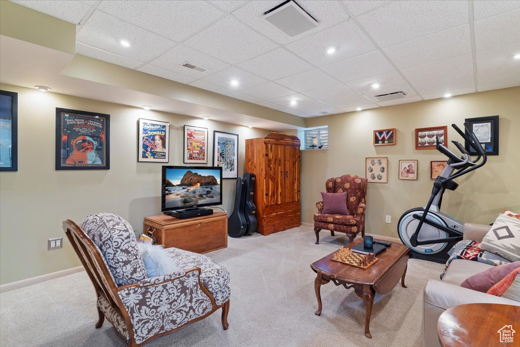 Living room featuring carpet, a drop ceiling, and recessed lighting