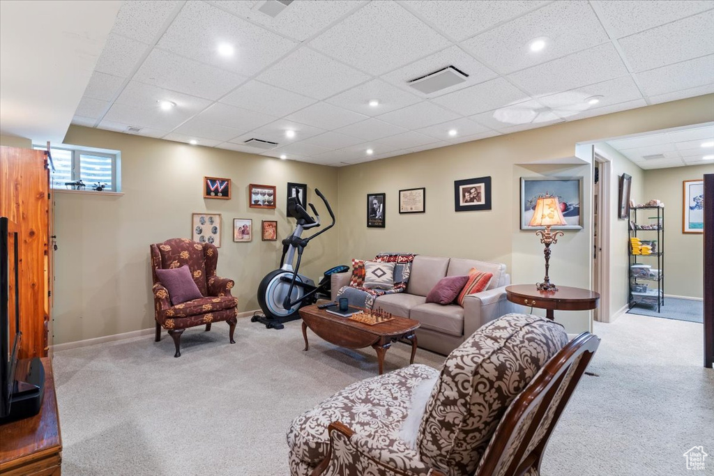 Living room featuring carpet floors, recessed lighting, and a paneled ceiling