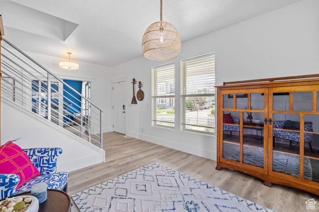 Entrance foyer featuring stairway and wood finished floors
