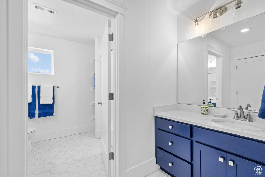 Bathroom with toilet and vanity