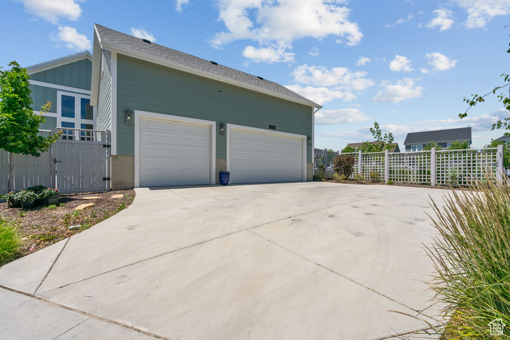 Garage featuring driveway