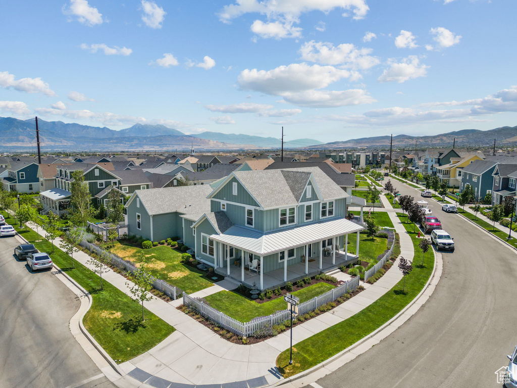 Aerial perspective of suburban area featuring a mountainous background