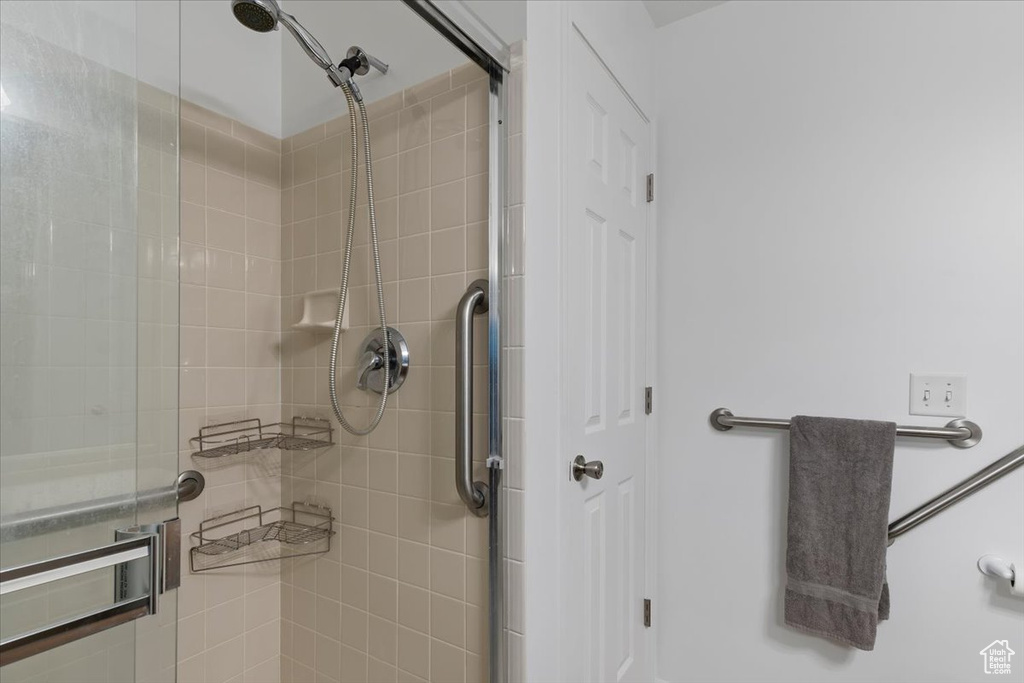 Full bathroom featuring a shower stall