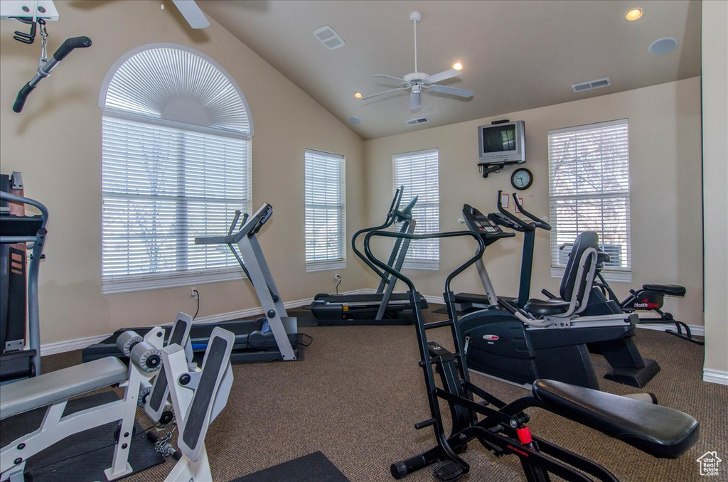 Gym featuring ceiling fan, recessed lighting, and vaulted ceiling