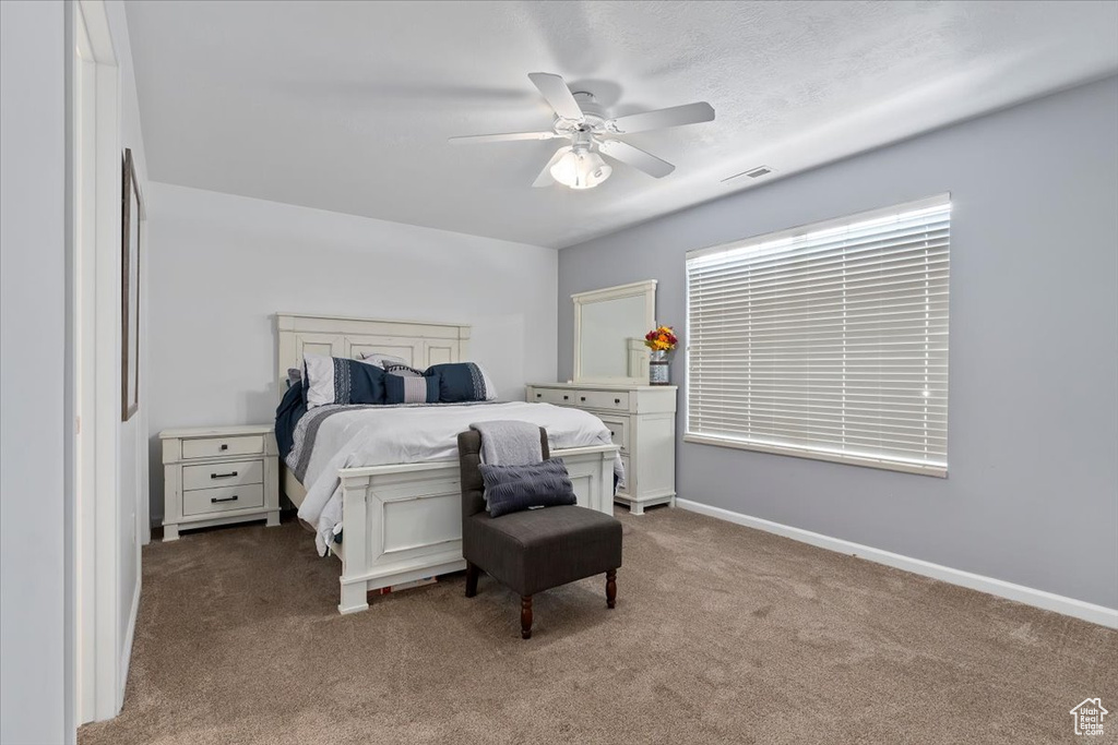 Bedroom with carpet and a ceiling fan