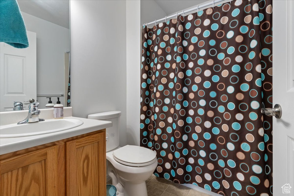 Full bath featuring vanity, tile patterned flooring, and a shower with curtain
