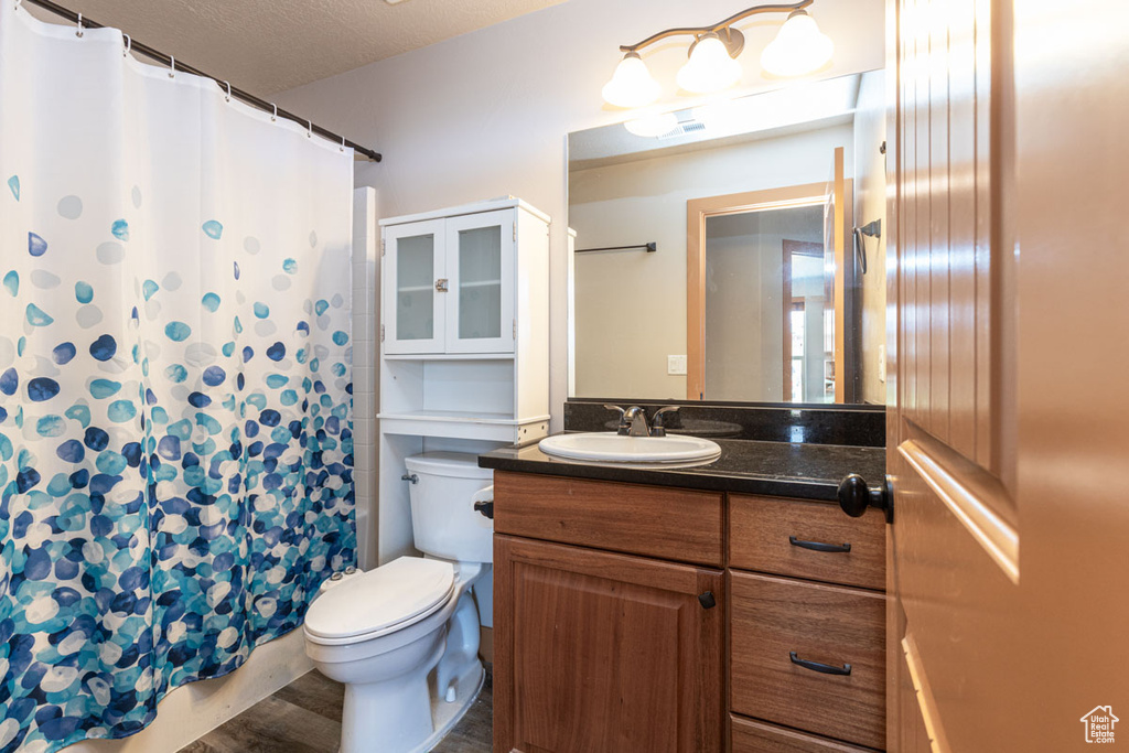 Bathroom featuring vanity and a shower with curtain