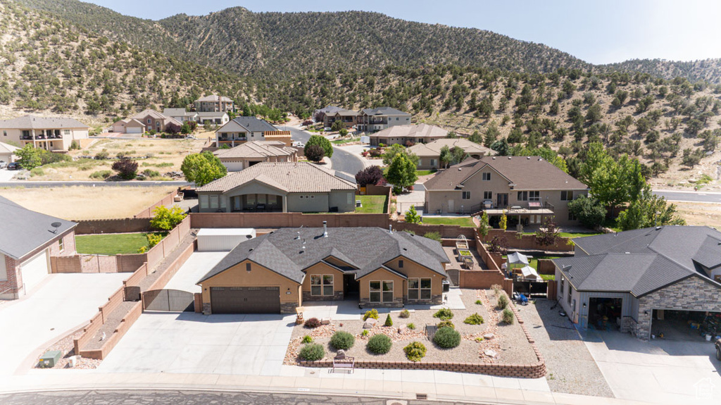 Aerial view of residential area featuring mountains