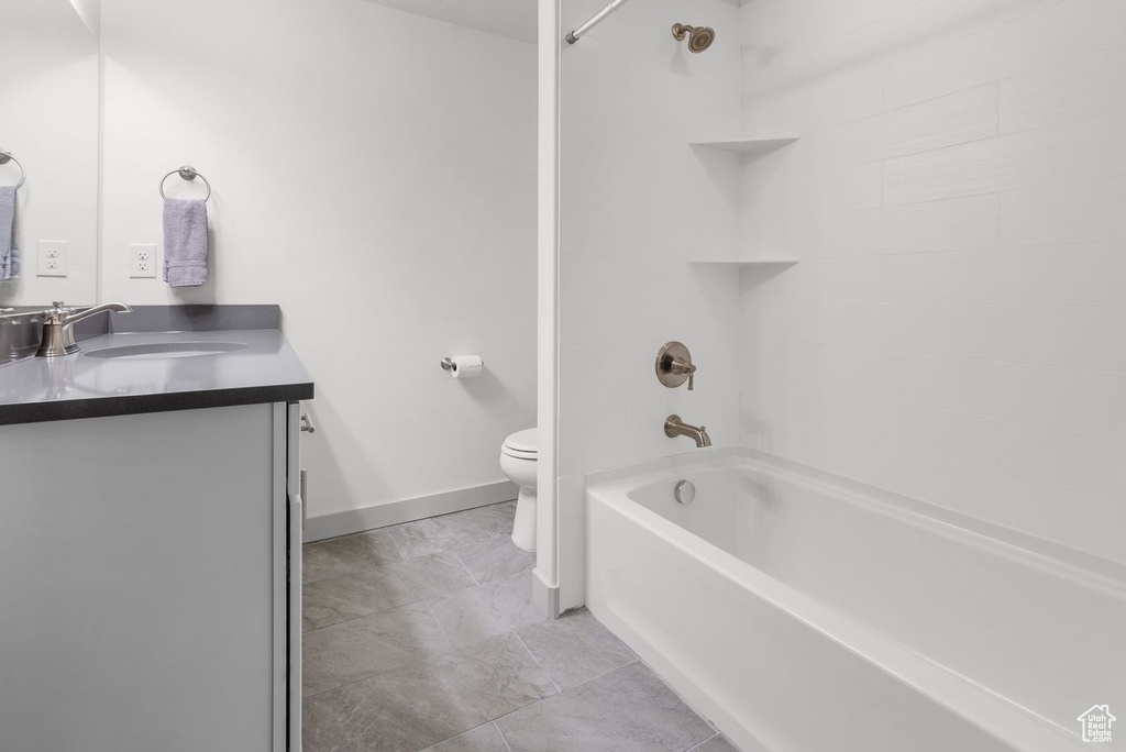 Full bath with vanity and shower / bath combination