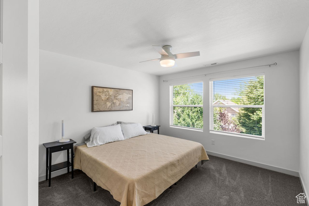 Bedroom with carpet flooring and ceiling fan