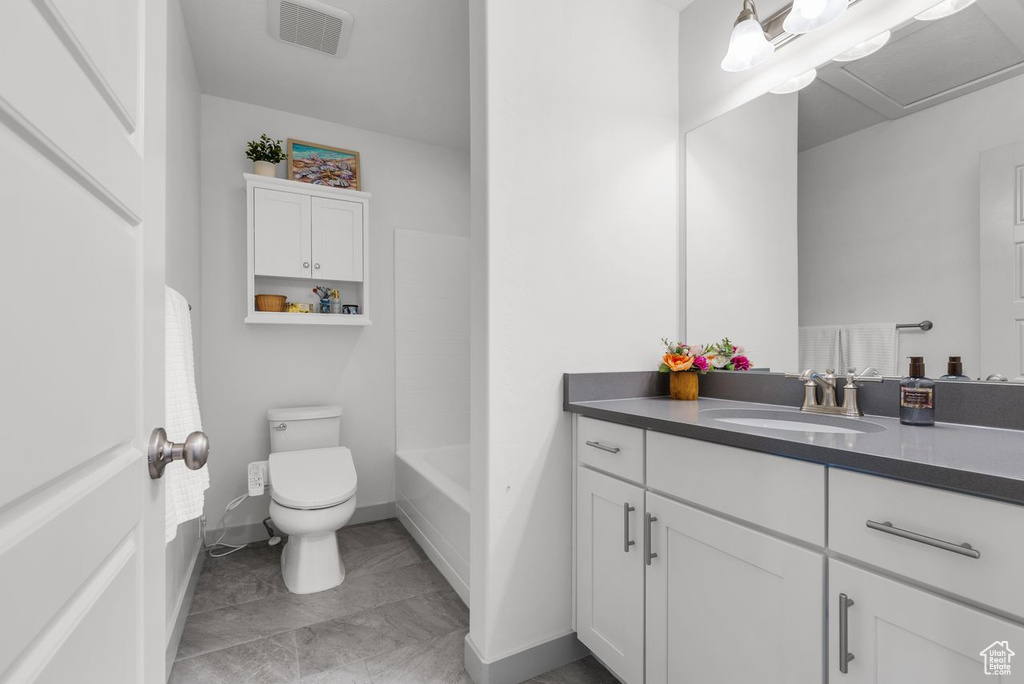 Full bathroom featuring vanity and a bath