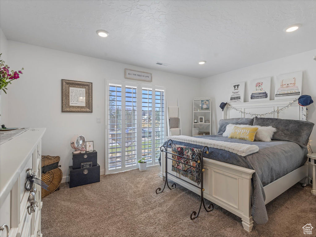 Carpeted bedroom with access to outside and recessed lighting