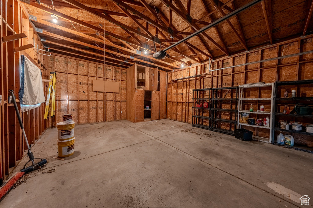 Miscellaneous room with a garage and concrete floors