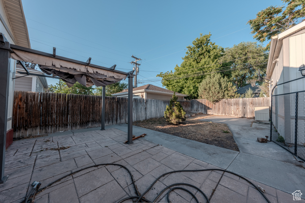 Fenced backyard featuring a patio