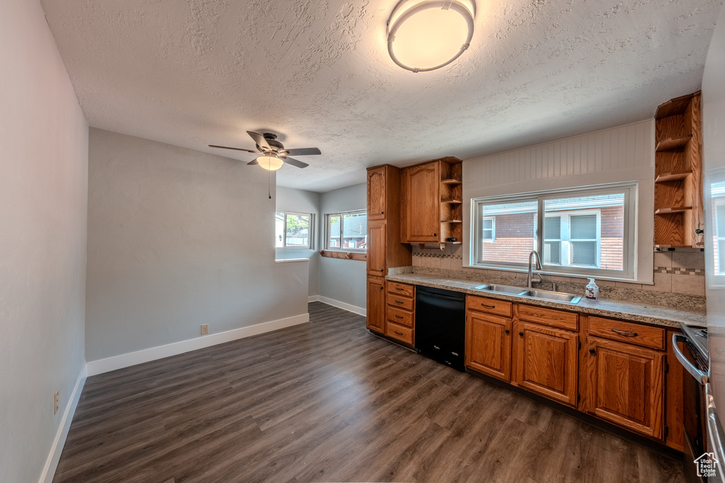 Kitchen with open shelves, dishwasher, a textured ceiling, range, and brown cabinetry