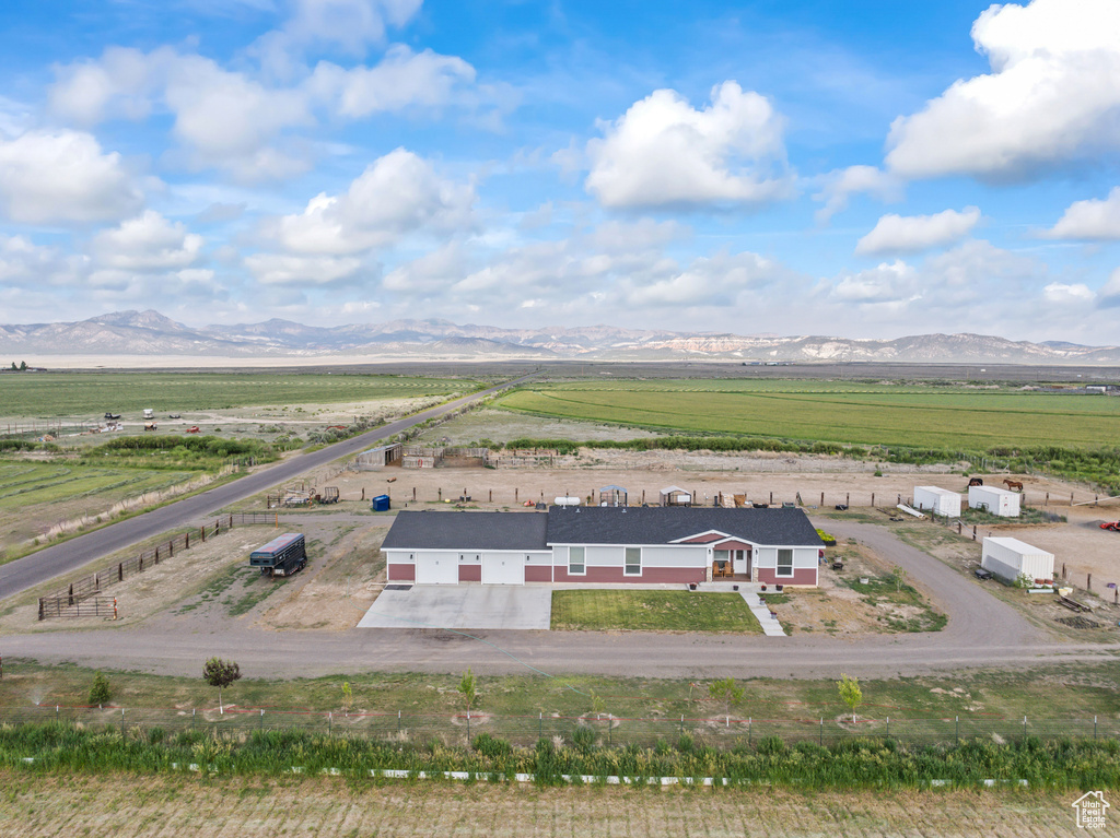 Aerial view of sparsely populated area featuring a mountain backdrop
