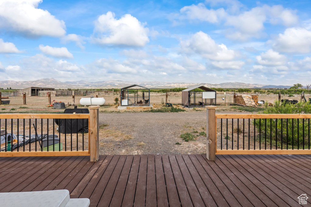 Wooden terrace featuring a mountain view