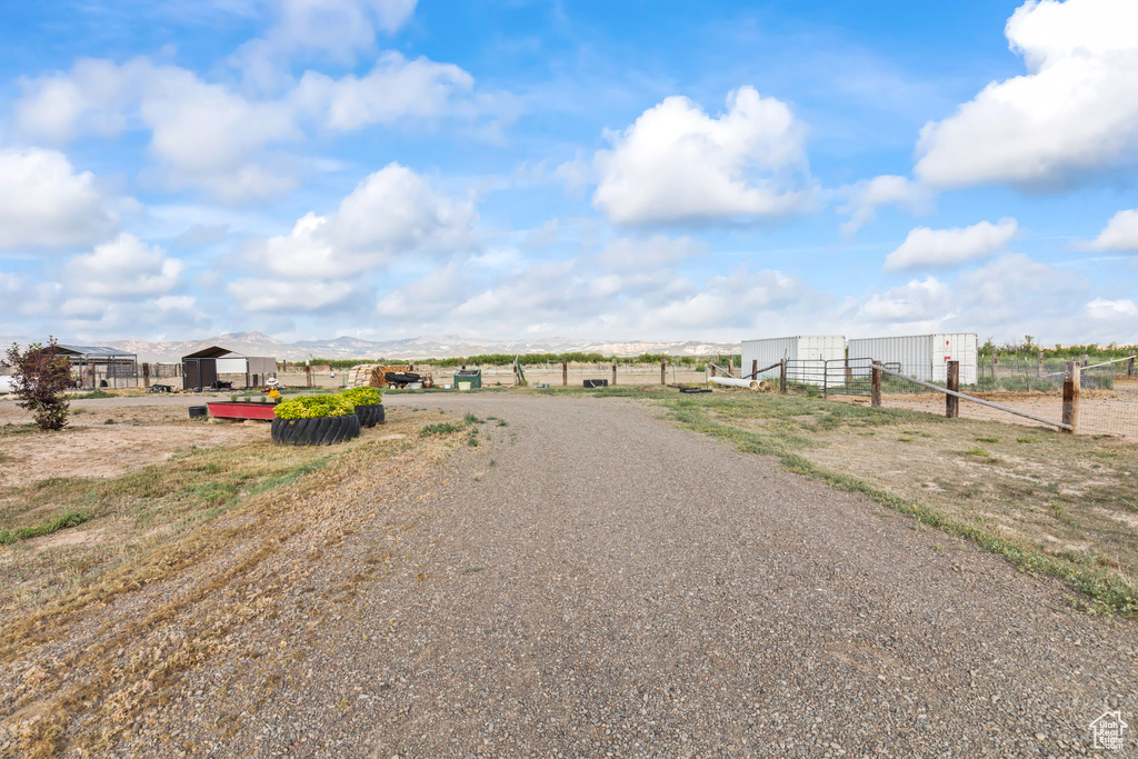 View of dirt / gravel road with a view of countryside