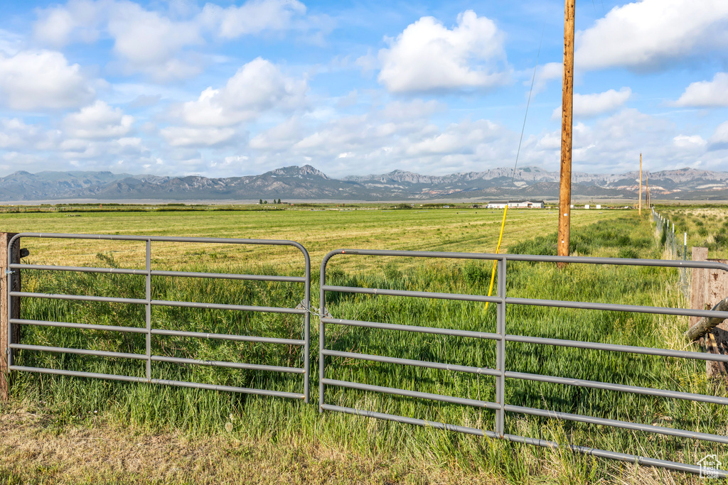 View of mountain backdrop with rural landscape