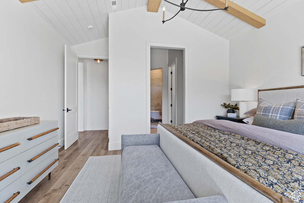 Bedroom featuring light wood-style flooring and ensuite bathroom