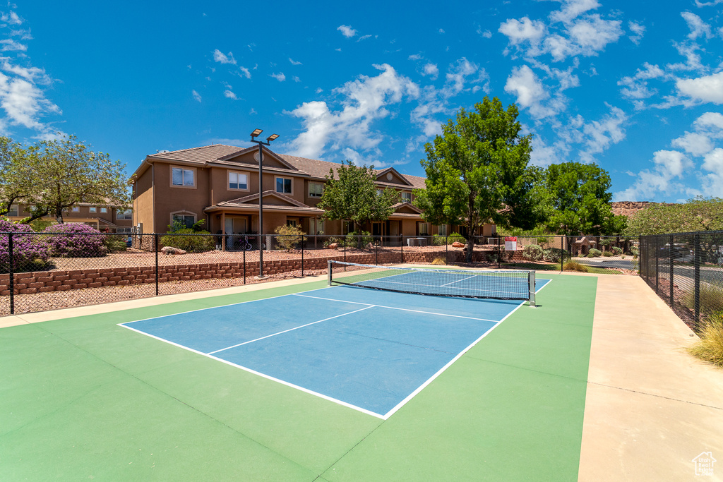View of tennis court featuring community basketball court