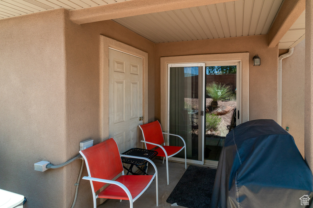 View of exterior entry with stucco siding