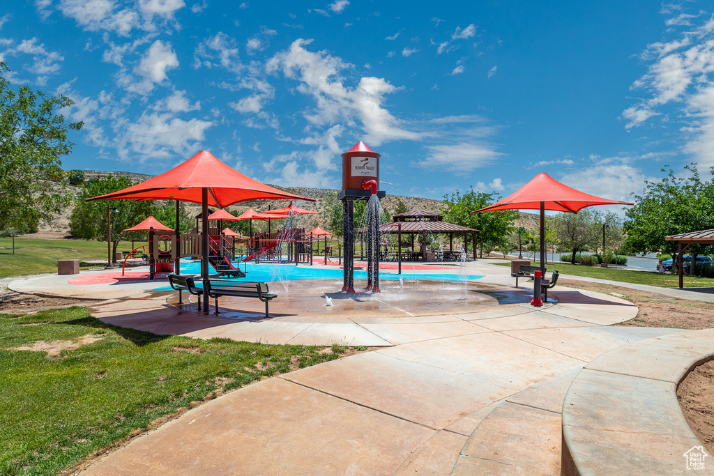 View of property's community featuring a gazebo and a lawn