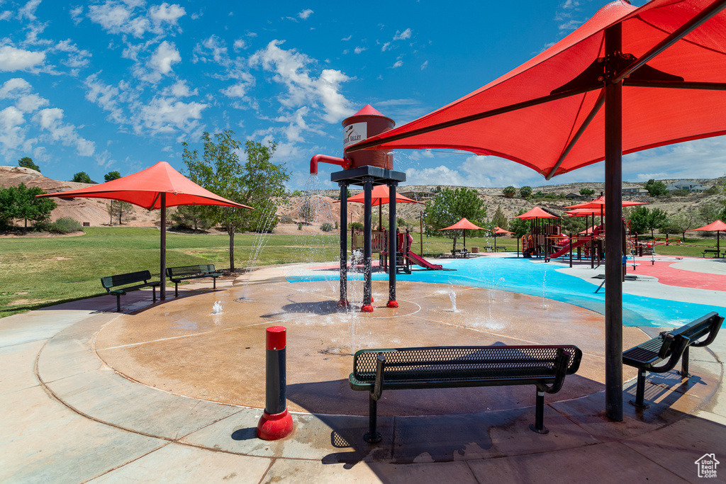 View of pool with a yard