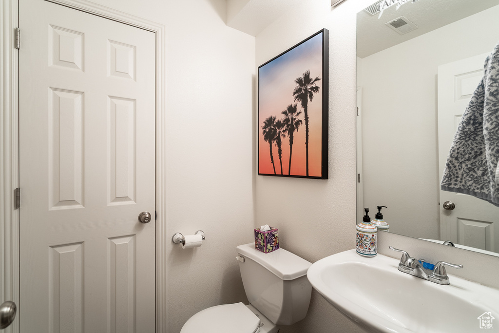 Bathroom featuring a sink and toilet