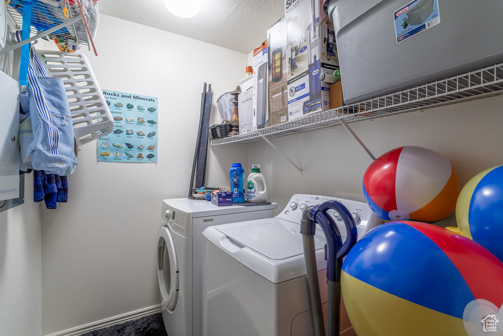 Laundry room featuring separate washer and dryer