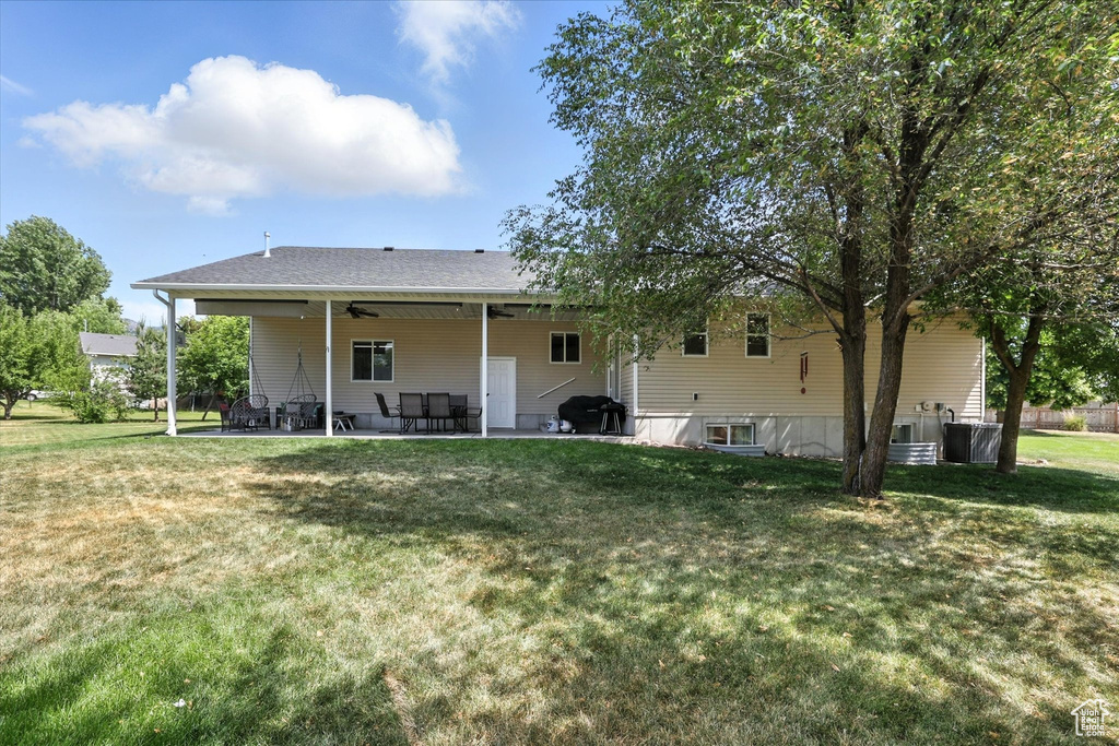 Back of house featuring a patio and a yard