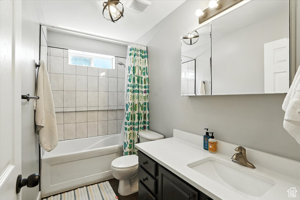 Full bathroom with vanity and shower / bath combo