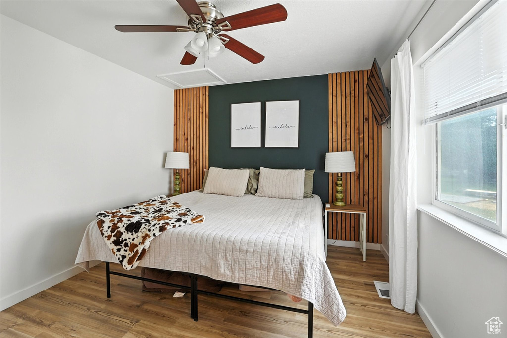 Bedroom featuring light wood-style flooring and a ceiling fan