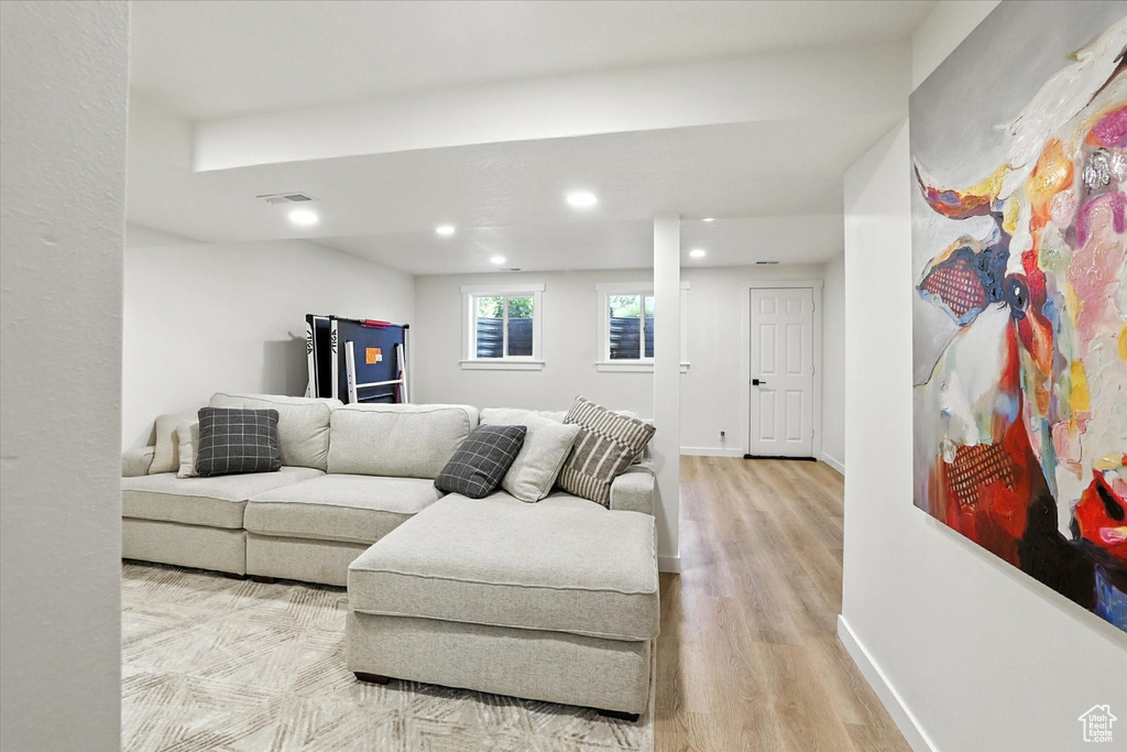 Living room featuring wood finished floors and recessed lighting
