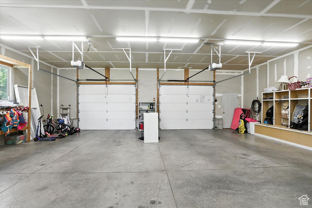 Garage featuring a garage door opener