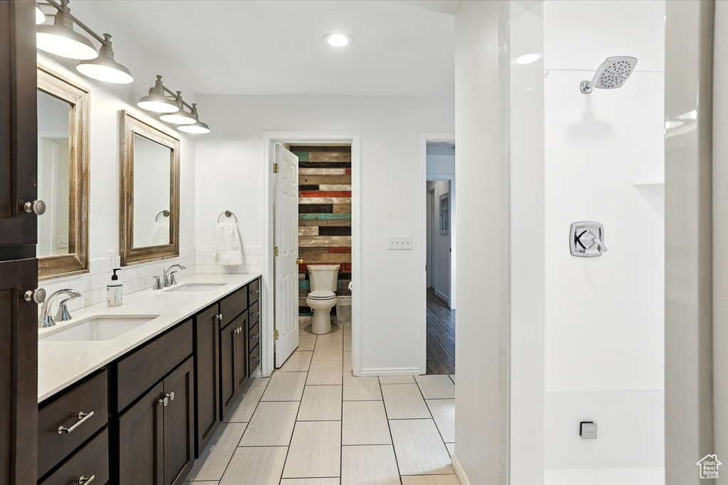 Bathroom featuring double vanity and recessed lighting