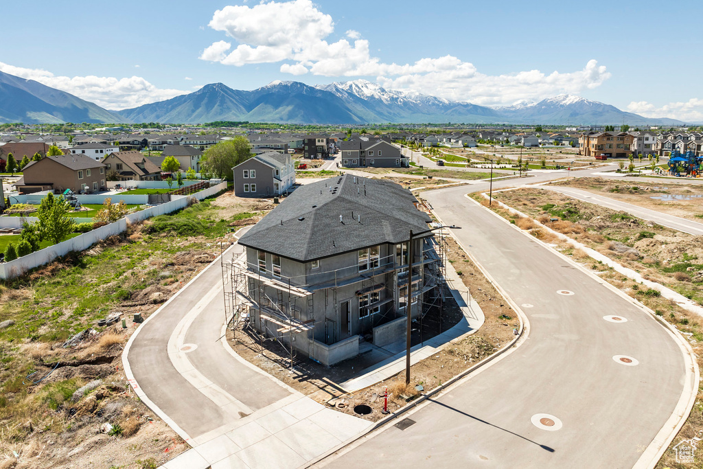 Aerial perspective of suburban area with a mountainous background