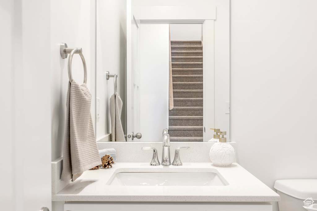 Bathroom with toilet and vanity