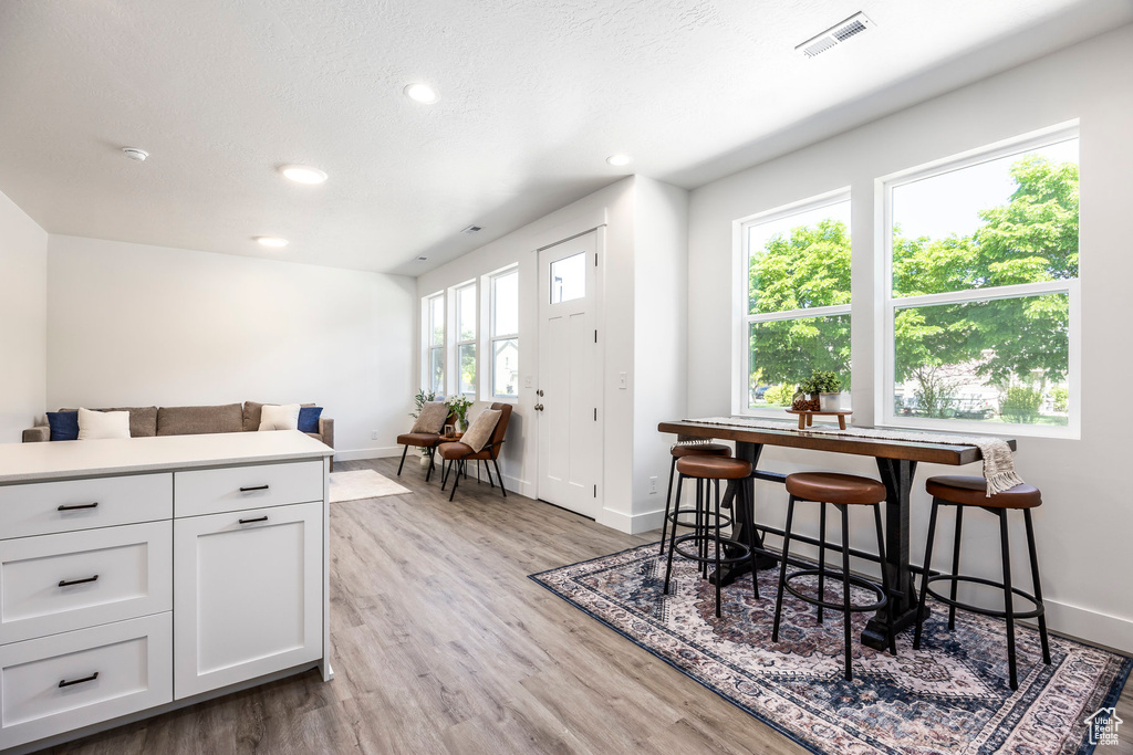 Dining room featuring recessed lighting and light wood-style flooring