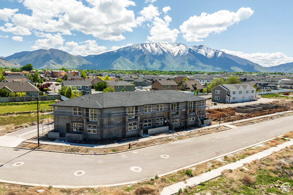 View of mountain backdrop featuring nearby suburban area