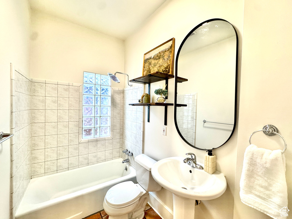 Bathroom with toilet and shower / tub combination