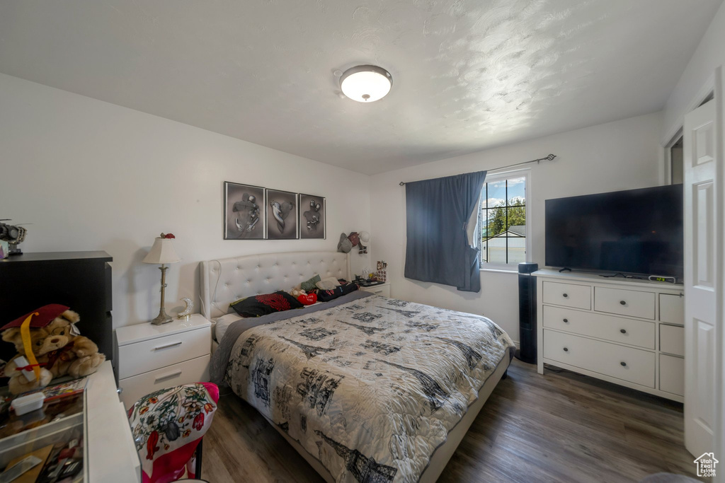 Bedroom featuring dark wood finished floors