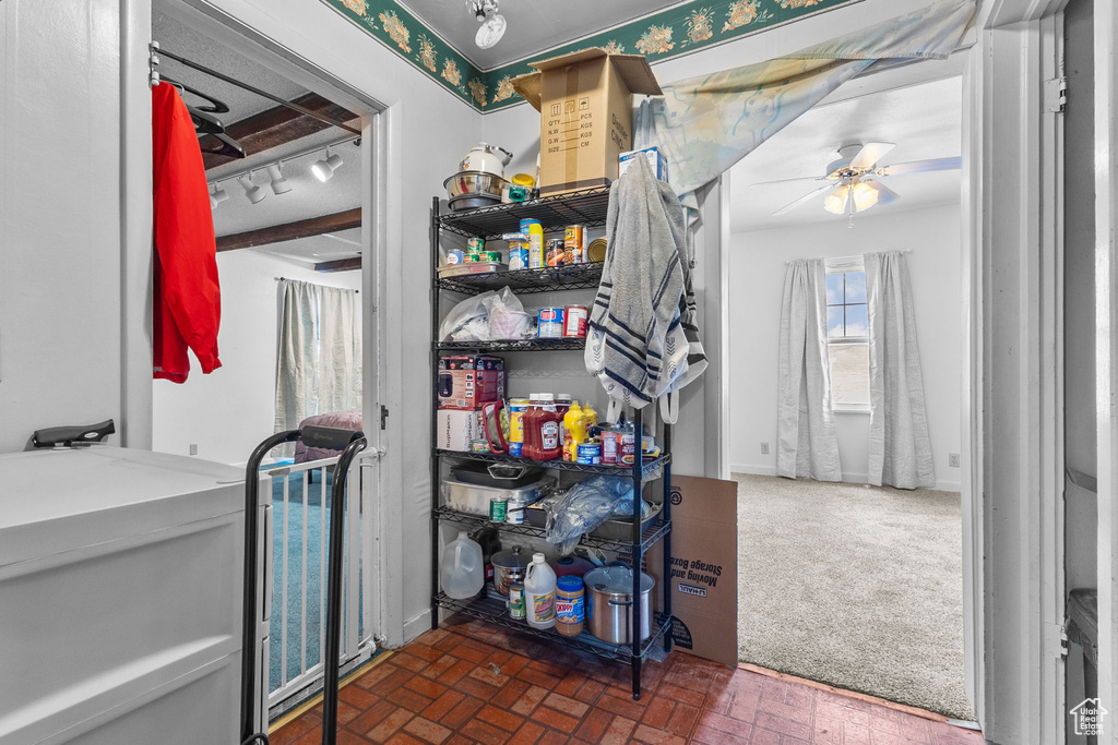 Storage room featuring a ceiling fan