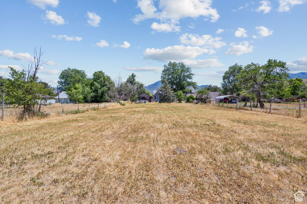 View of yard with a view of rural / pastoral area and a mountain view