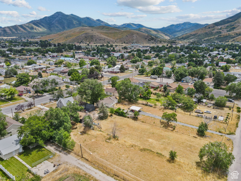 Aerial view of residential area featuring a mountainous background