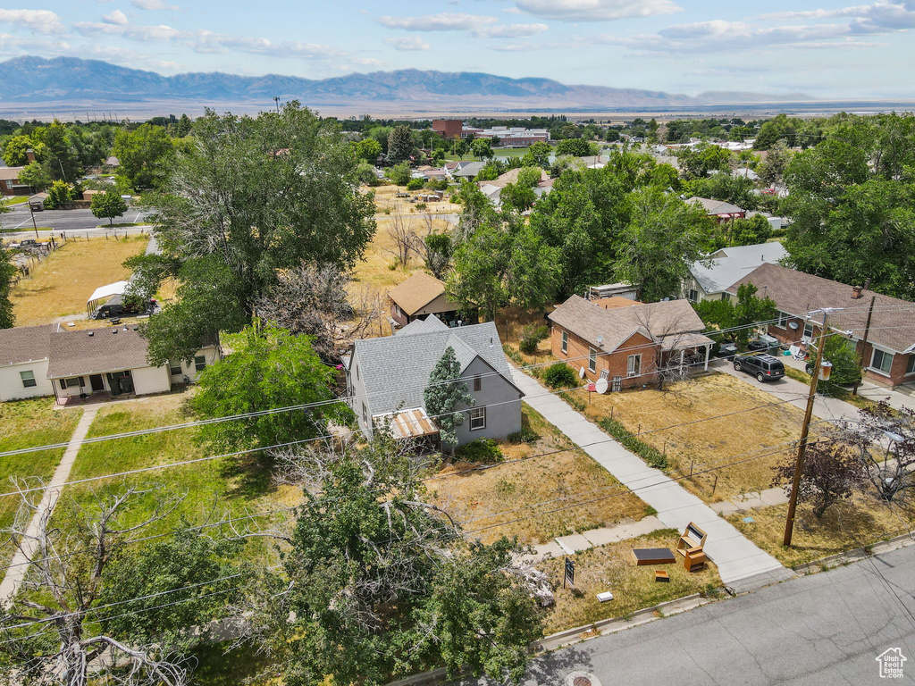 Aerial perspective of suburban area with a mountain backdrop
