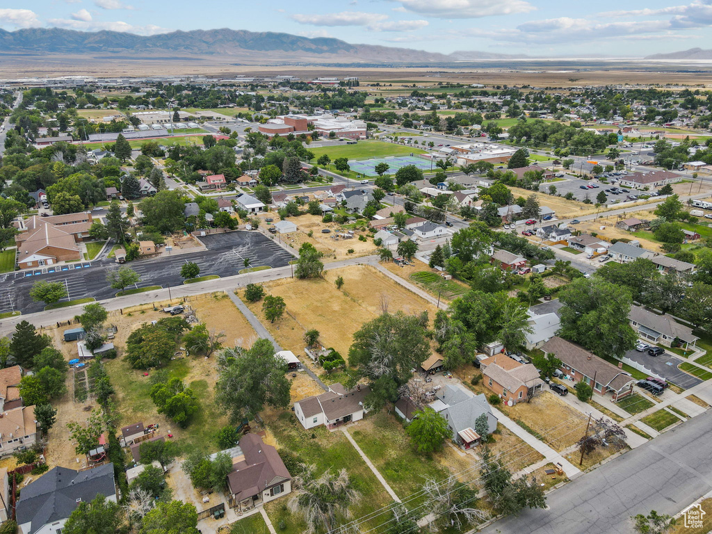 Aerial view of property\'s location with mountains and nearby suburban area